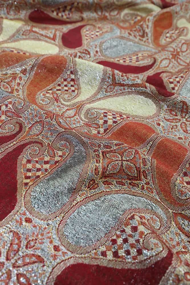 fabric detail of burgundy metallic pashmina shawl