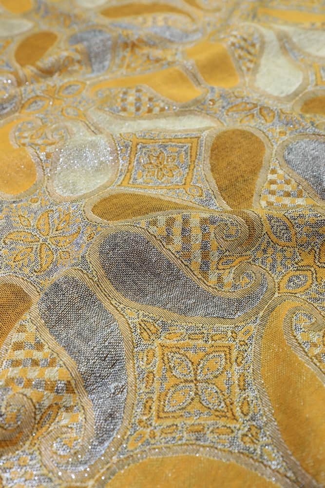 fabric detail of gold metallic pashmina shawl